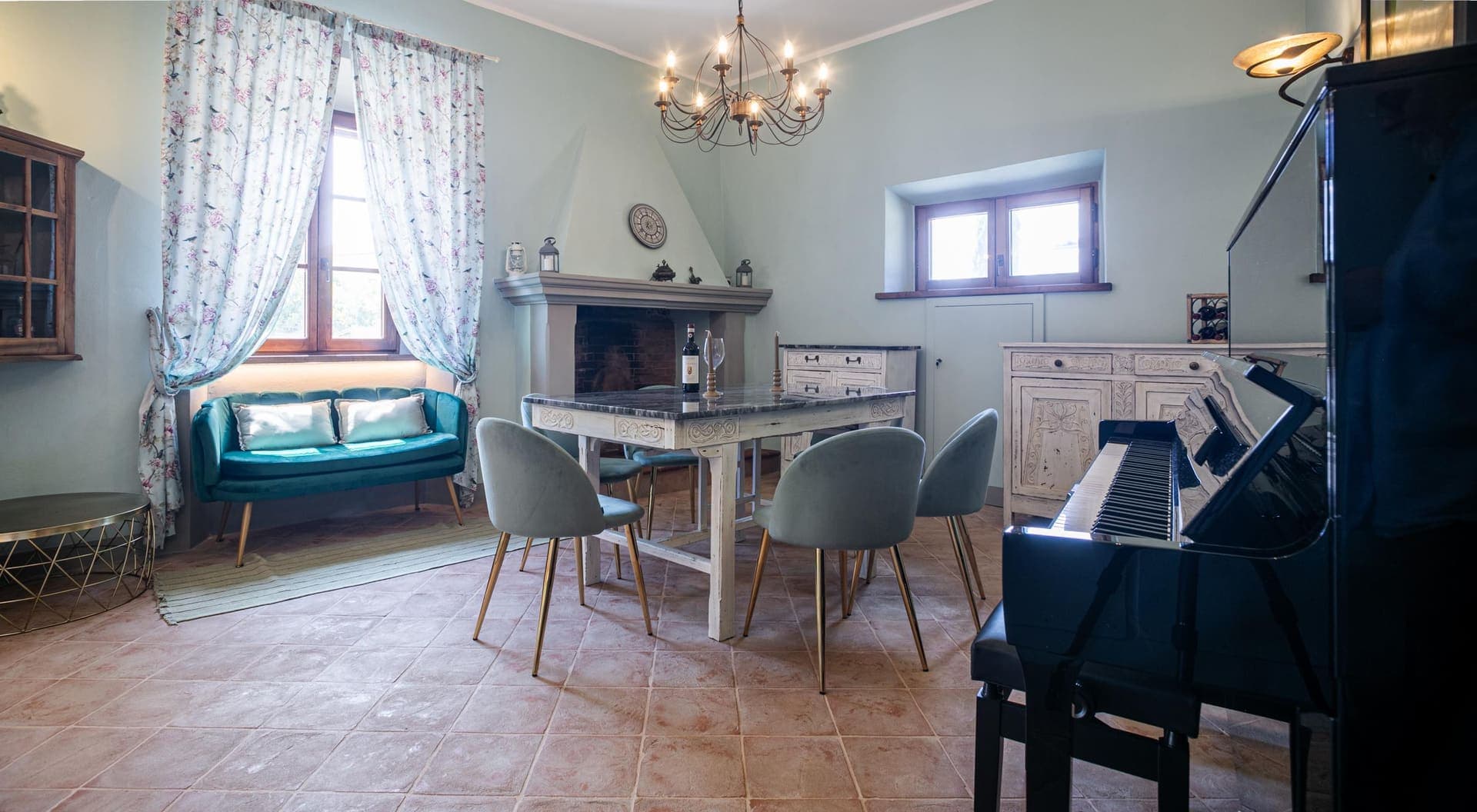 The baby grand piano in the dining room